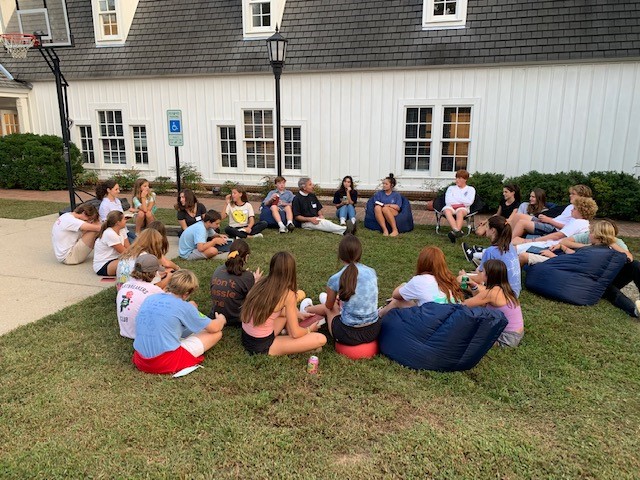 Sunday School Youth talking on lawn